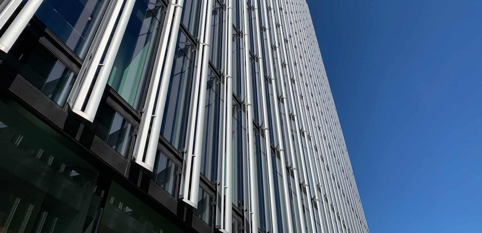 A low angle photo of a high skyscraper. How to Get a Job at Deloitte
