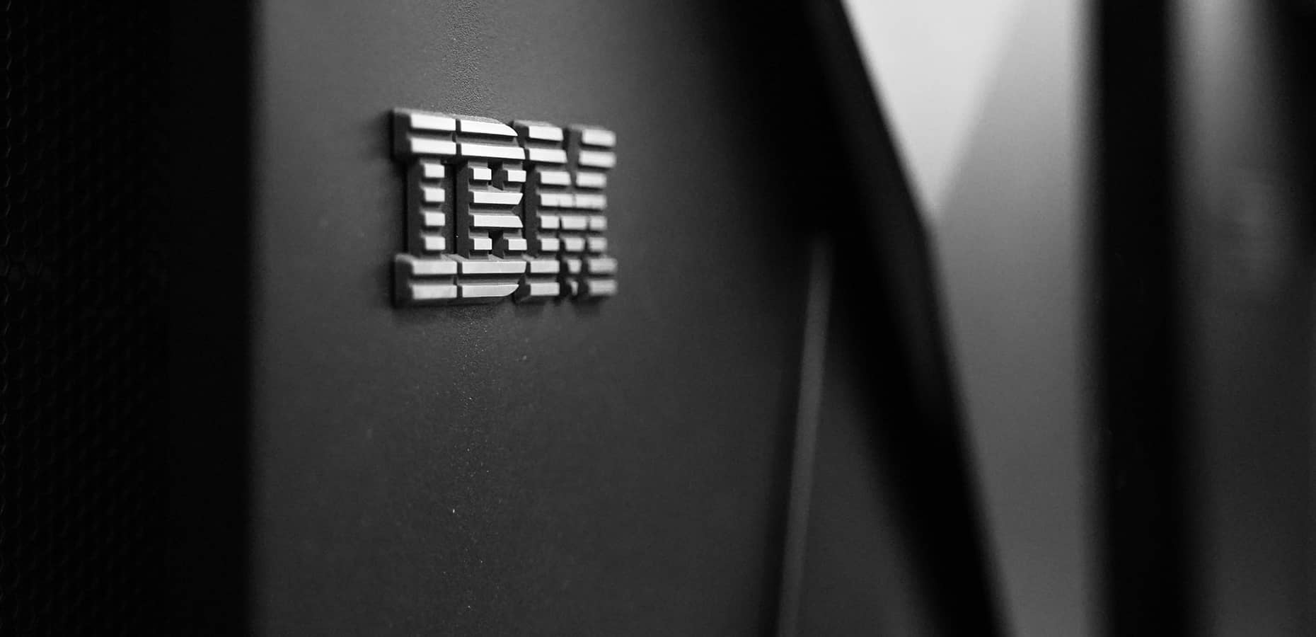 A black and white image of the IBM logo on a wall. IBM Hiring Process: Getting a Job at IBM